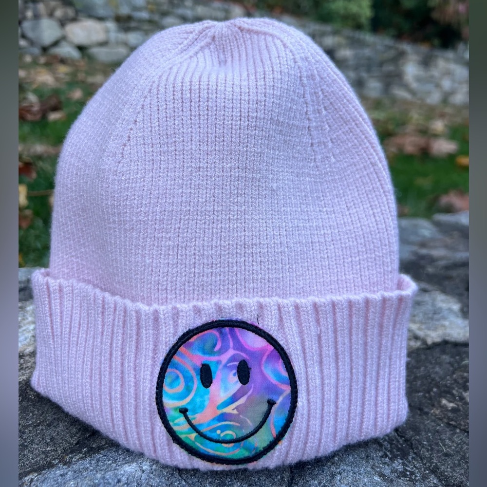 Pink beanie hat with handmade smile patch. Never worn.